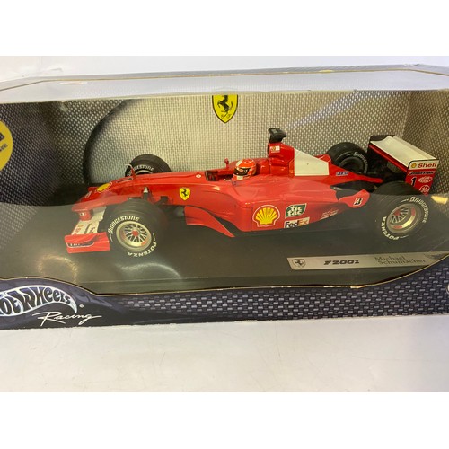 906 - 2 x Hot Wheels models, a Ferrari F2001 Michael Schumacher model 50202 and a 1999 Ferrari F399