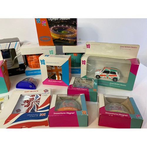 908 - Selection of 2012 olympic memorabilia including 3 x mugs, boxed diecast mini and taxi, 3 x paperweig... 