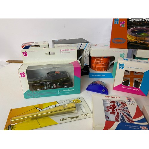 908 - Selection of 2012 olympic memorabilia including 3 x mugs, boxed diecast mini and taxi, 3 x paperweig... 