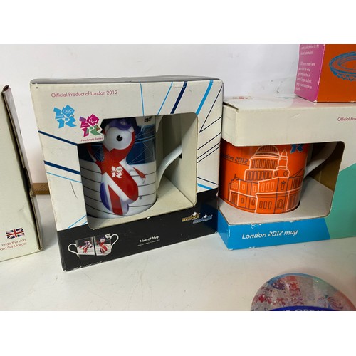 908 - Selection of 2012 olympic memorabilia including 3 x mugs, boxed diecast mini and taxi, 3 x paperweig... 