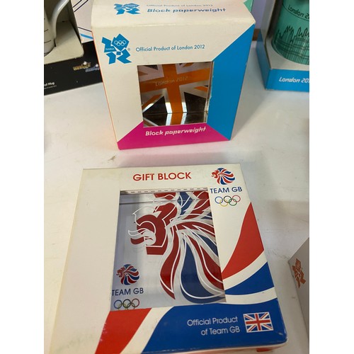 908 - Selection of 2012 olympic memorabilia including 3 x mugs, boxed diecast mini and taxi, 3 x paperweig... 