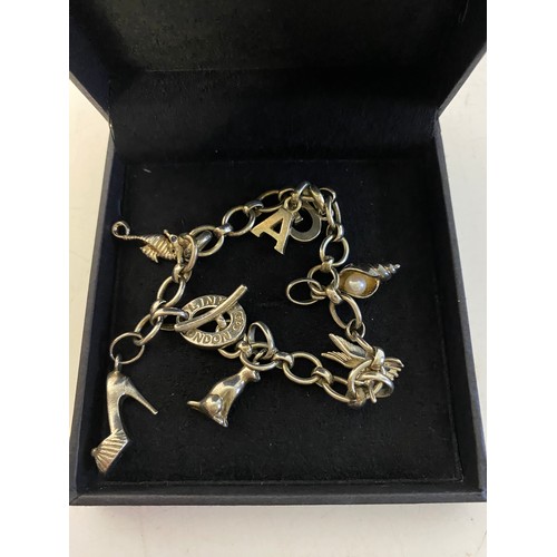 922 - Links of London boxed silver charm bracelet with 7 charms including shoe, seahorse, cat, shell and o... 