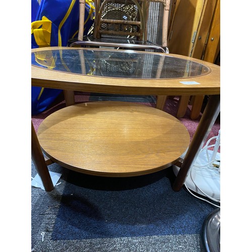 917 - G-Plan style mid century round coffee table with glass inset and lower shelf. 69x38cms