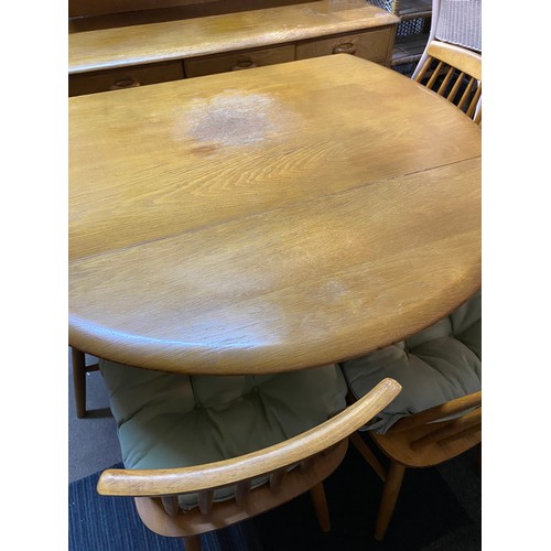 954 - Ercol style light oak drop leaf dining table and 4 chairs.