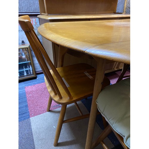 954 - Ercol style light oak drop leaf dining table and 4 chairs.