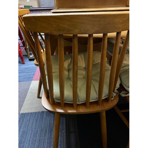 954 - Ercol style light oak drop leaf dining table and 4 chairs.