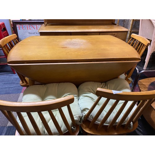 954 - Ercol style light oak drop leaf dining table and 4 chairs.