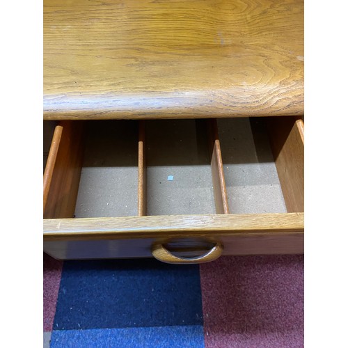 955 - Ercol style light oak sideboard with concertina opening door, 3 drawers and display shelving to top.