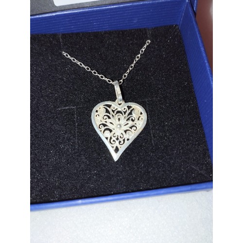 676 - Continental 935 silver filigree heart pendant and chain.