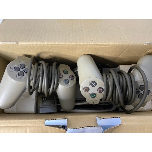 794 - Boxed PS1 console with 2 controllers, leads and memory card. Fully tested and working.