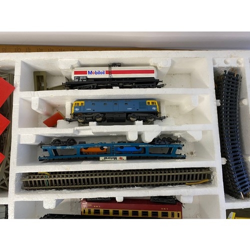 825 - Boxed Lima train set including trains, track, swing bridge and unloading containers