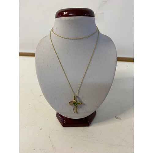 121 - 10ct gold cross pendant and chain set with Emerald and Diamond