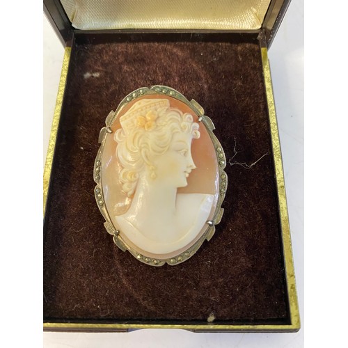 122 - A 9ct gold Victorian cameo brooch and a 1920's .800 silver and marcasite cameo brooch