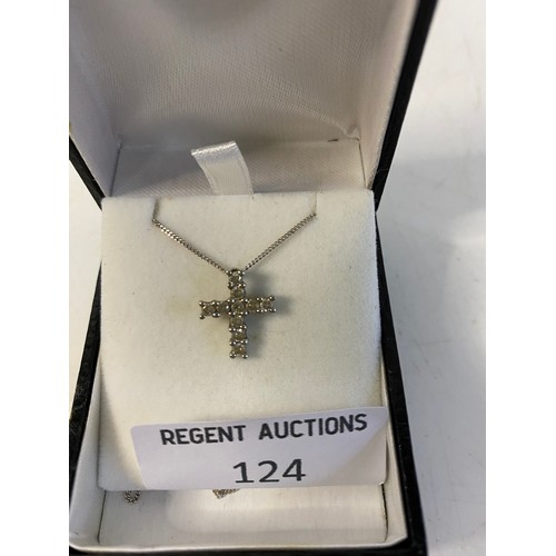 124 - 9 ct white gold cross pendant set with 0.42ct diamonds, presented on 925 silver chain.