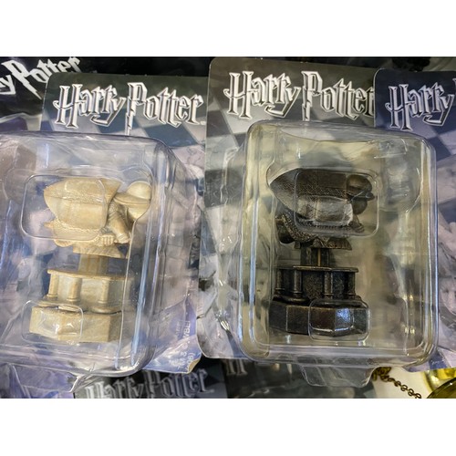 145 - Selection of Harry Potter items including chess pieces, games and audiobooks.