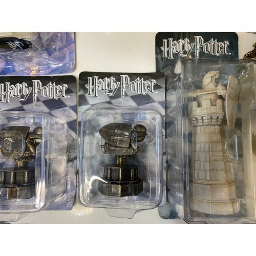 145 - Selection of Harry Potter items including chess pieces, games and audiobooks.