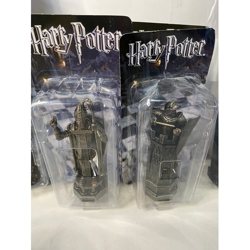 145 - Selection of Harry Potter items including chess pieces, games and audiobooks.