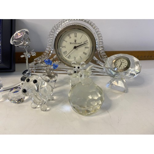 154 - Collection of crystal items including a Waterford crystal clock, Stuart crystal vase and various orn... 