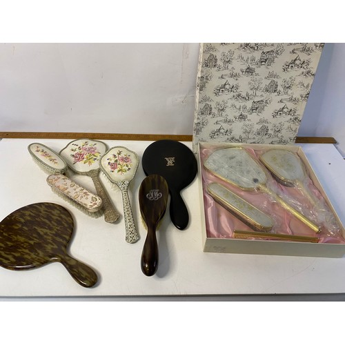 176 - Assortment of vintage vanity sets, hand mirrors and brushes