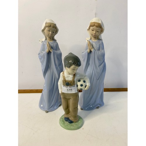 179 - Pair of Nao praying girl figures and a Nao boy with football, largest measuring 27cms tall