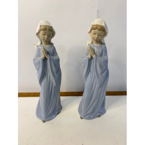 179 - Pair of Nao praying girl figures and a Nao boy with football, largest measuring 27cms tall