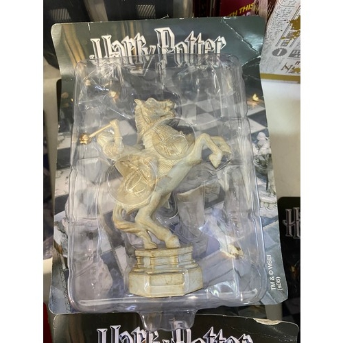 145 - Selection of Harry Potter items including chess pieces, games and audiobooks.