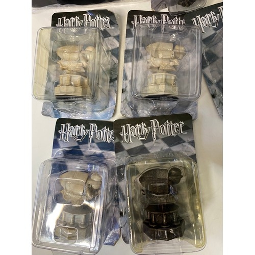 145 - Selection of Harry Potter items including chess pieces, games and audiobooks.