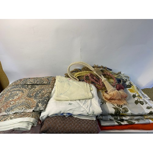 498 - Selection of curtain fabric and vintage curtains and curtain tie backs.