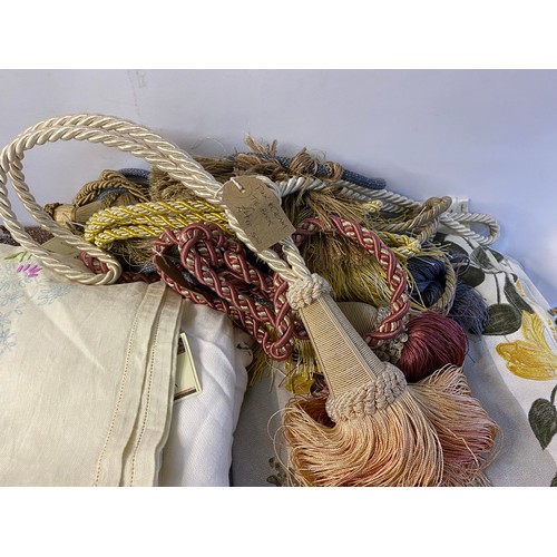 498 - Selection of curtain fabric and vintage curtains and curtain tie backs.