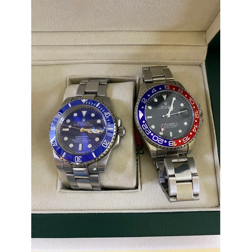 490 - A copy Rolex Submariner watch in box with papers and a copy RGMT- Master II without box.