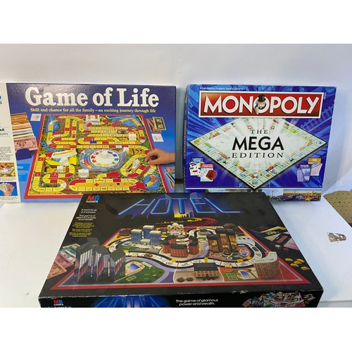 501 - Selection of 3 x board games, MB Games 'Game of Life' and 'Hotel' and Hasbro 'Monopoloy The Mega Edi... 