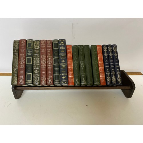 325 - Vintage mahogany book trough and a selection of books.