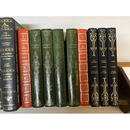 325 - Vintage mahogany book trough and a selection of books.