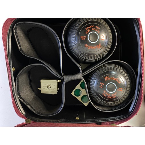 151 - An assortment of lawn bowls in carry case.