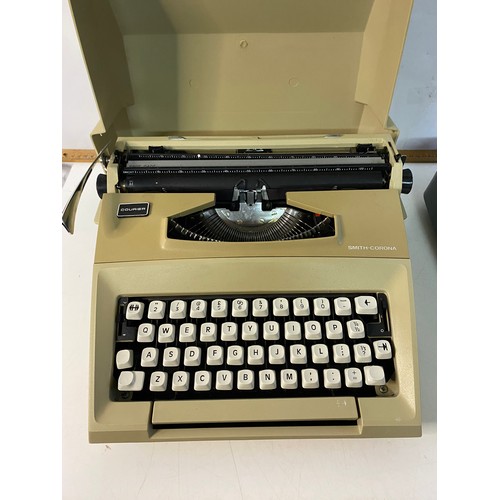 154 - 2 vintage Typewriters, a Smith Corona Courier and Zephyr Deluxe.