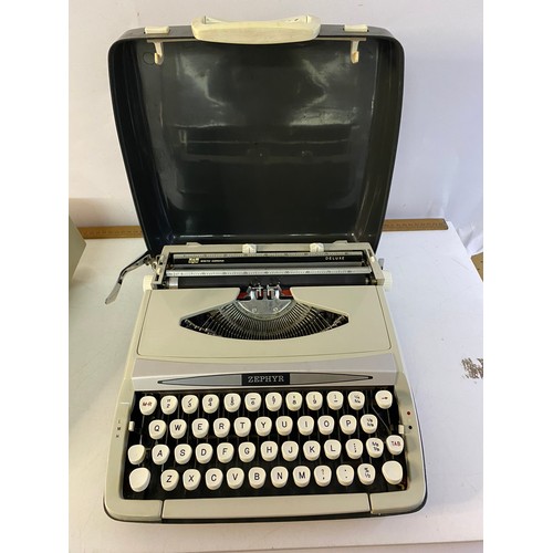 154 - 2 vintage Typewriters, a Smith Corona Courier and Zephyr Deluxe.