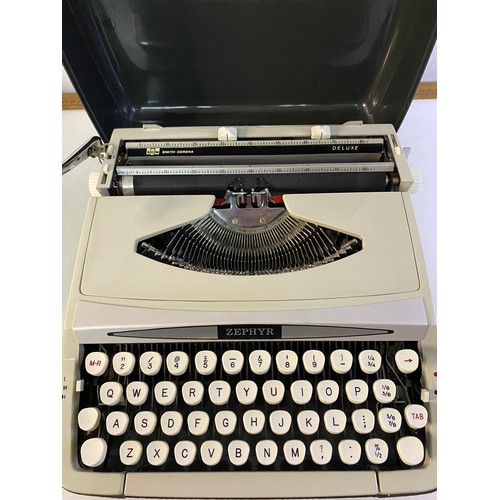 154 - 2 vintage Typewriters, a Smith Corona Courier and Zephyr Deluxe.