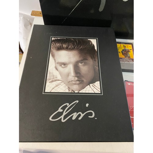 166 - 2 Elvis CD collector box sets and assorted Elvis DVDs, books and records.