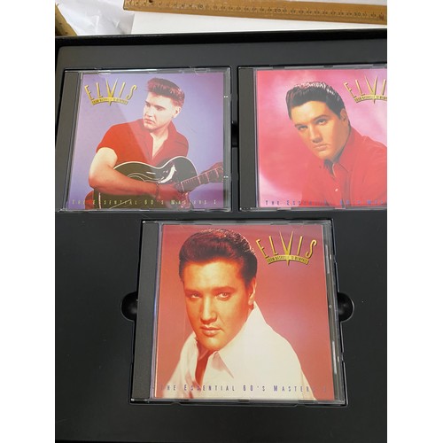 166 - 2 Elvis CD collector box sets and assorted Elvis DVDs, books and records.