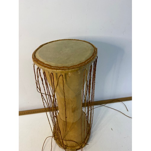 191 - Argentinian Bombo Leguro drum 47x38cm and an African talking drum 43cm tall