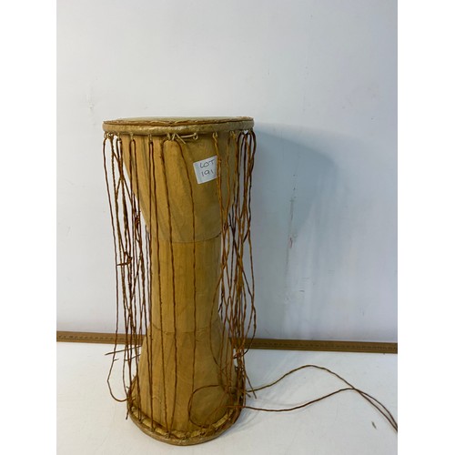 191 - Argentinian Bombo Leguro drum 47x38cm and an African talking drum 43cm tall