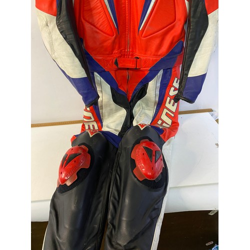 200 - Dainese 2 piece leather motorcycle race suit size 52 in used condition.