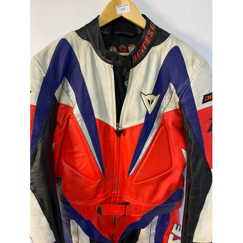 200 - Dainese 2 piece leather motorcycle race suit size 52 in used condition.