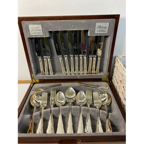 204 - Dubarry design mahogany cased cutlery set plus basket of other assorted cutlery.