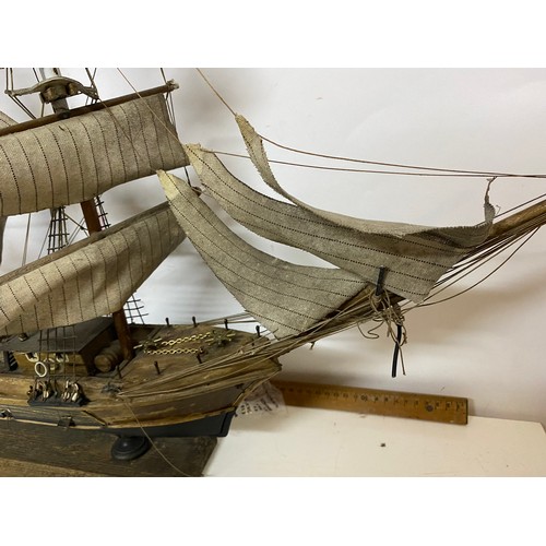 137 - Handmade model of a Ship. Some repair needed, 84cm wide by 60cm tall.