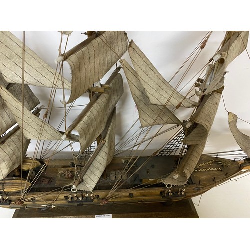 137 - Handmade model of a Ship. Some repair needed, 84cm wide by 60cm tall.