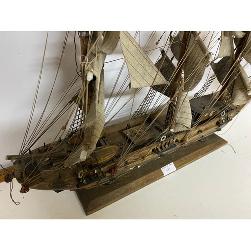 137 - Handmade model of a Ship. Some repair needed, 84cm wide by 60cm tall.