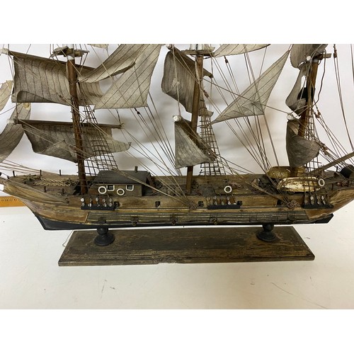 137 - Handmade model of a Ship. Some repair needed, 84cm wide by 60cm tall.