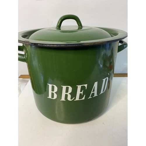 211 - Vintage green enamel bread bin containing vintage kitchenalia and Victorian knife sharpener.