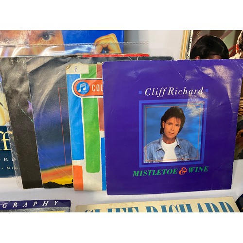 218 - Selection of Cliff Richards records, CDs and books.